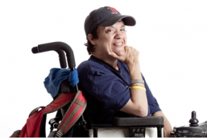 Photo from the Our Stories exhibit of Dennise, an individual in a wheelchair