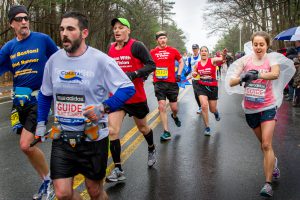 Randy Pierce and guides as well as Kyle Robidoux and guides running in the Boston Marathon