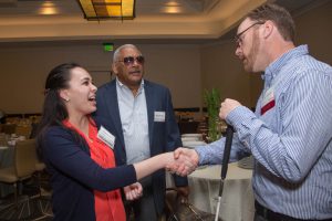 Stephanie Ross and Dean say hi to Kyle Robidoux at a Volunteer Appreciation Brunch
