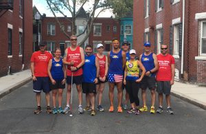 Team With A Vision and Team Coastal Athletic Association pose together before a training run together