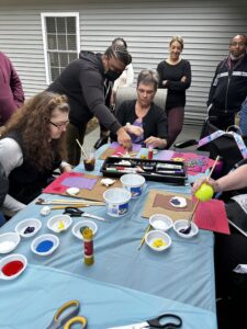 A group of participants partaking in an art workshop